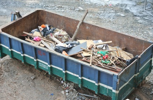 Waste collection trucks in Alperton streets