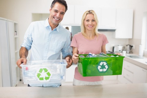 Office building with recycling bins illustrating waste management